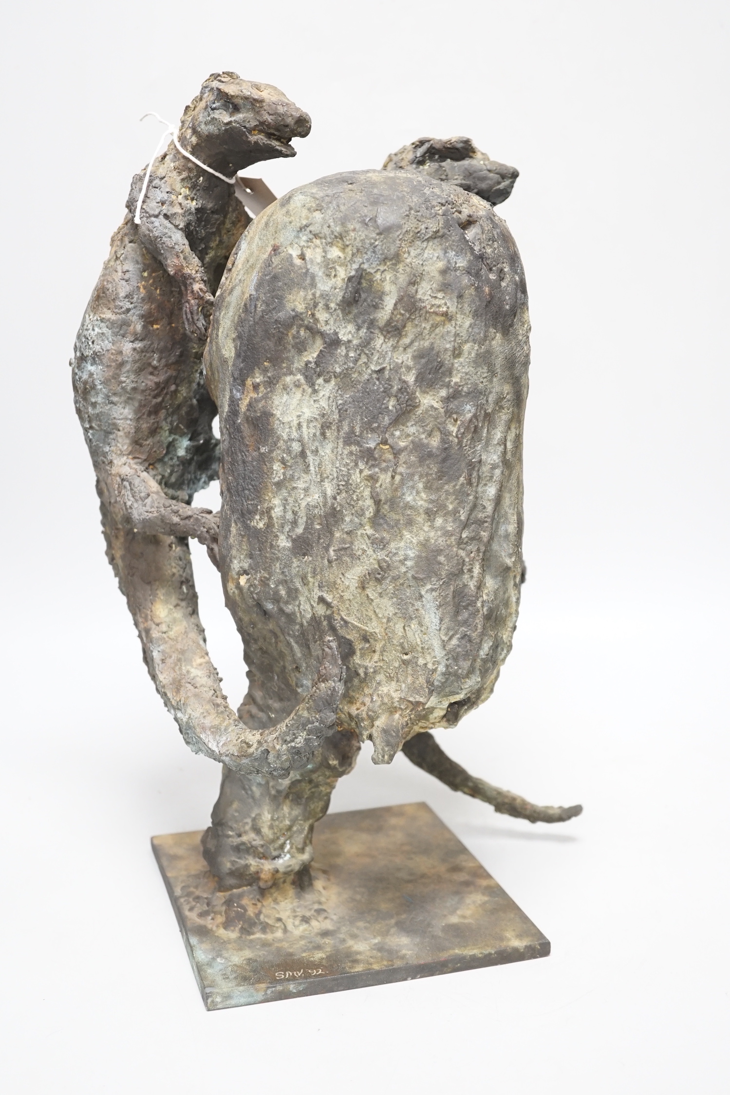 A patinated bronze, two lizards scaling a rock, raised on a square base, monogrammed SMV and dated 1992 to the base, 40cm high